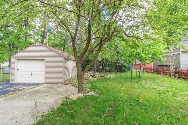 1.5 car garage (& Rear yard, closest tree now gone) - 615 Parkside Drive