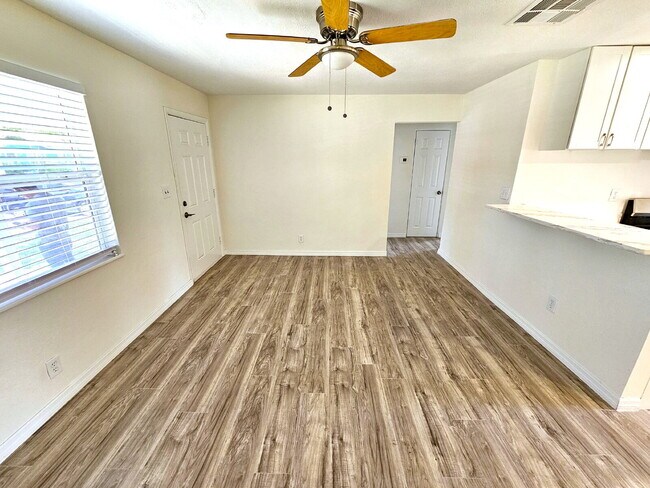 Building Photo - fully renovated 2-bedroom, 1-bathroom home with bonus guest room or office and oversized fenced yard