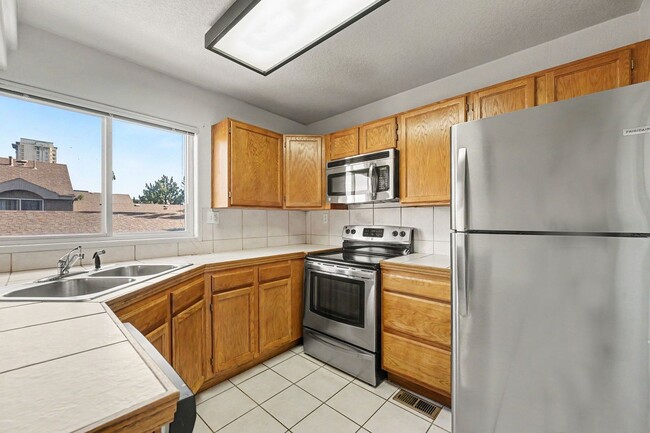 Building Photo - Beautiful 2BR Townhome in Gated Community with 2-Car Garage