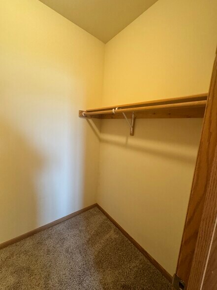 Primary Walk-in closet - Stone Creek Gardens