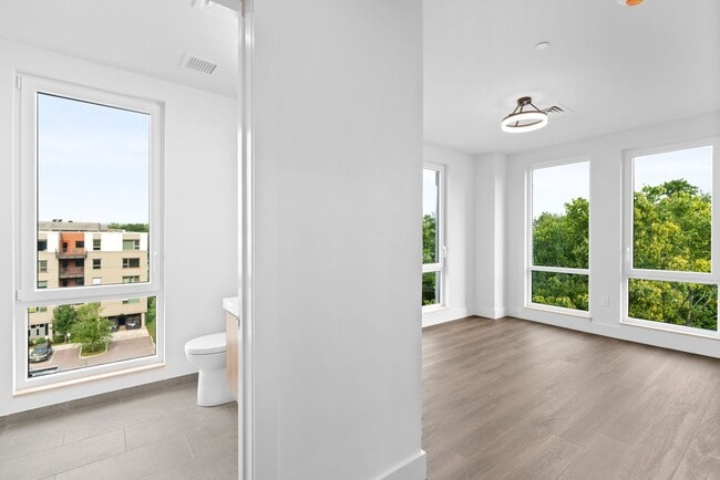 Building Photo - 2 Bedroom Corner-Unit with Wooded Balcony ...