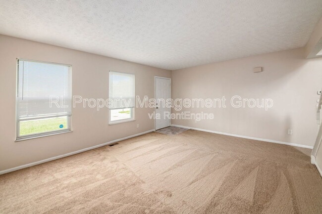 Building Photo - 7179 Feather Ct