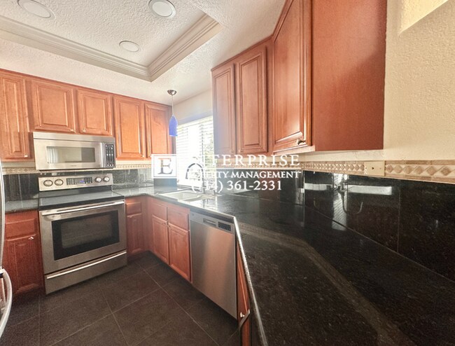 Building Photo - Top-Floor 2-Bed Condo in Huntington Beach | Walk to Beach