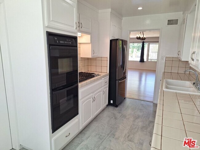 Building Photo - 6446 Riggs Pl