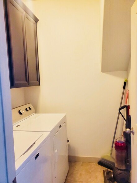 Separate laundry room with washer and dryer. Great for storage. - 10387 S Sturgeon Drive