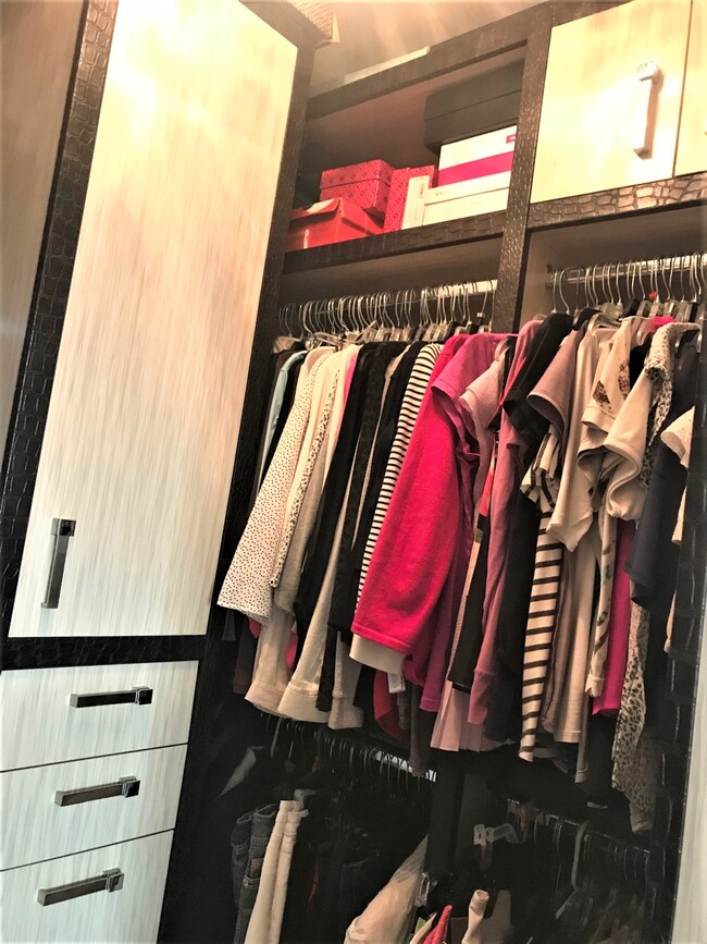 Master Closet with custom cabinets. - 15901 Collins Ave