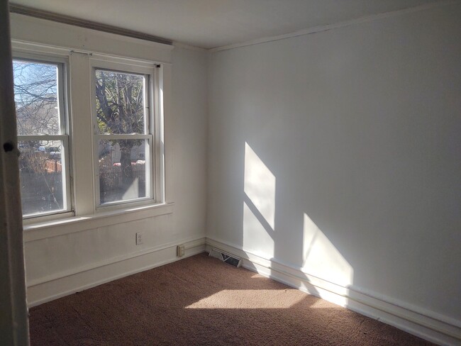 Spacious second bedroom with dedicated AC window unit outlet - 223 Cedar Ave