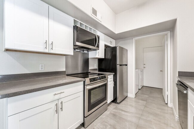 Building Photo - Modern Gated Condo with Upgraded Interior and Attached Garage in Prime South Las Vegas Location!