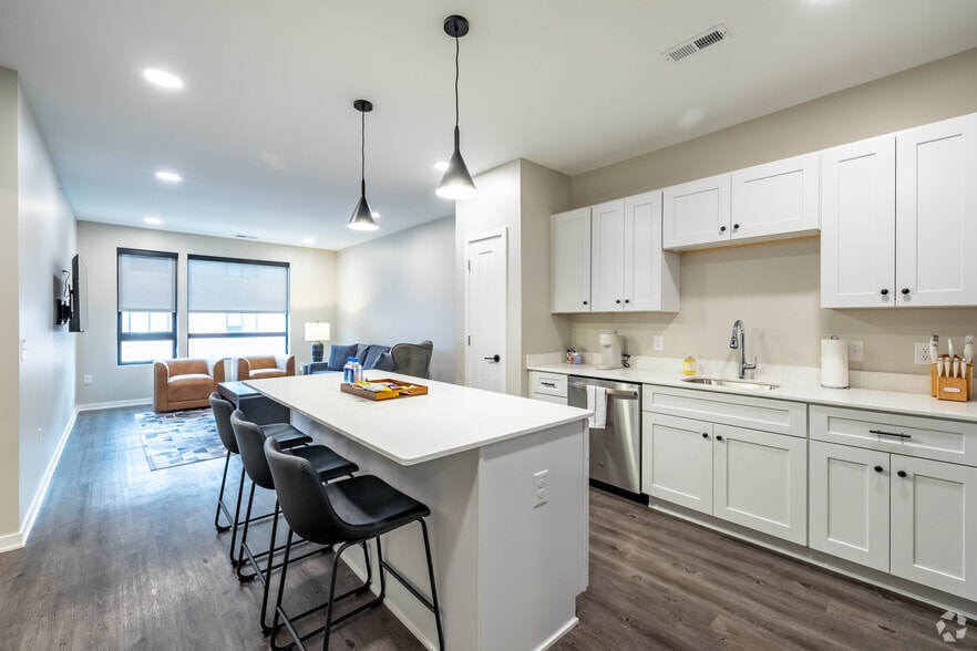 1BR, 1BA w/Den - 1,030SF - Kitchen and Dining Area - Leavenworth Lofts