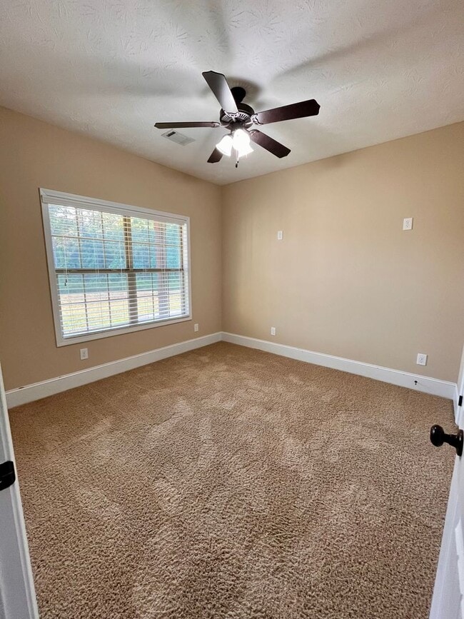 Building Photo - Spacious 3-Bedroom Home with Garage, Large...