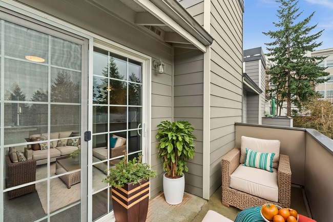 Step into this charming balcony retreat, perfect for relaxing with a view of lush greenery. - Monte Vista Apartments