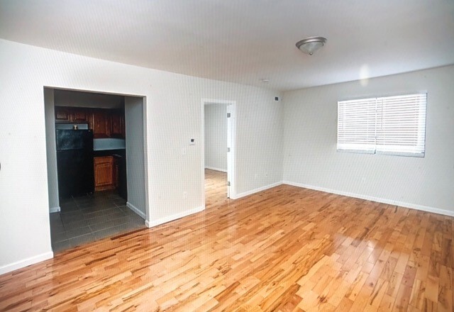 View of Living Area, Kitchen And Bedroom Entrance - Sea Breeze Apartments