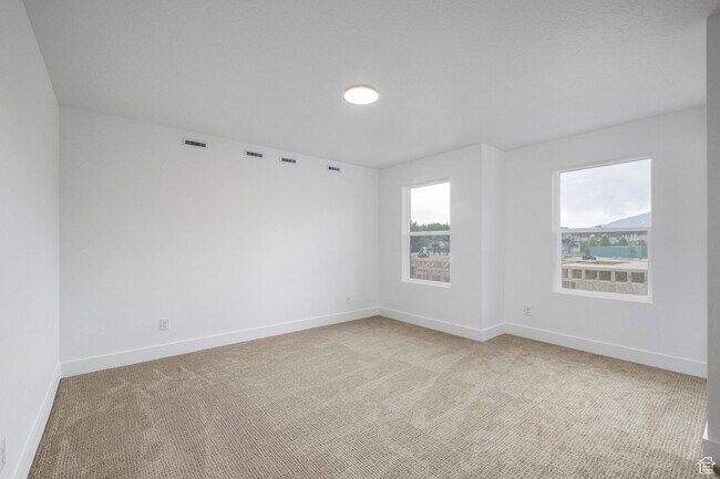 Building Photo - 3-bedroom, 2.5-bath townhome offering modern living in an unbeatable location.