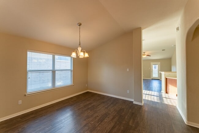 Building Photo - Charming Brick Home with Open Floorplan, Vaulted Ceilings, and Luxurious Amenities—Perfect for An...