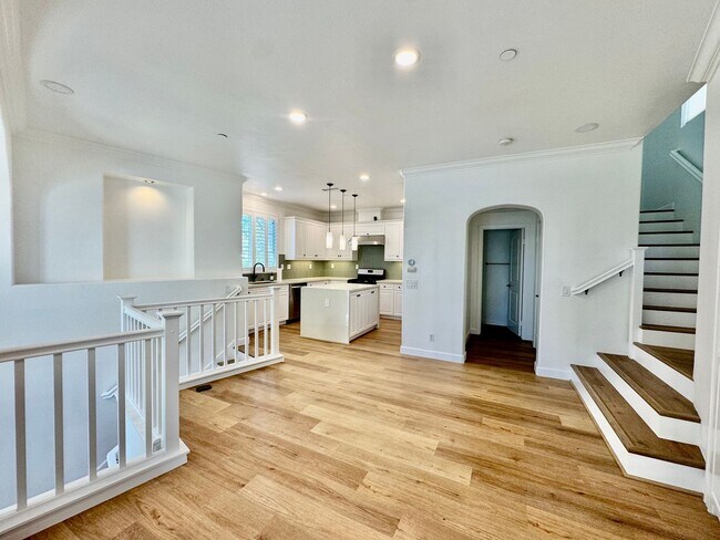 Building Photo - Beautifully Remodel Townhouse with AC & Two Car Garage!
