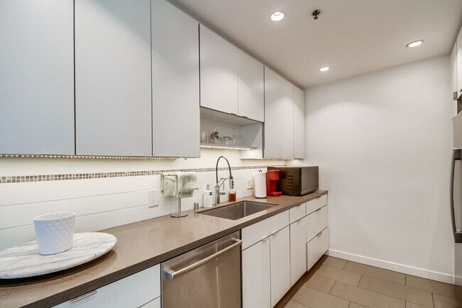 Building Photo - Penthouse Living in Charming Little Italy