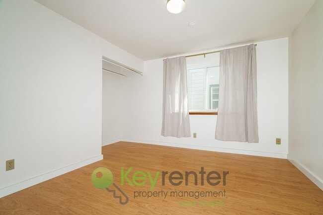 Building Photo - **Rent Special** Remodeled Two-Bedroom with Open Floor Plan, Parking, and Easy Transit Access