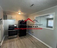 Building Photo - Step into comfort and security in this bea...