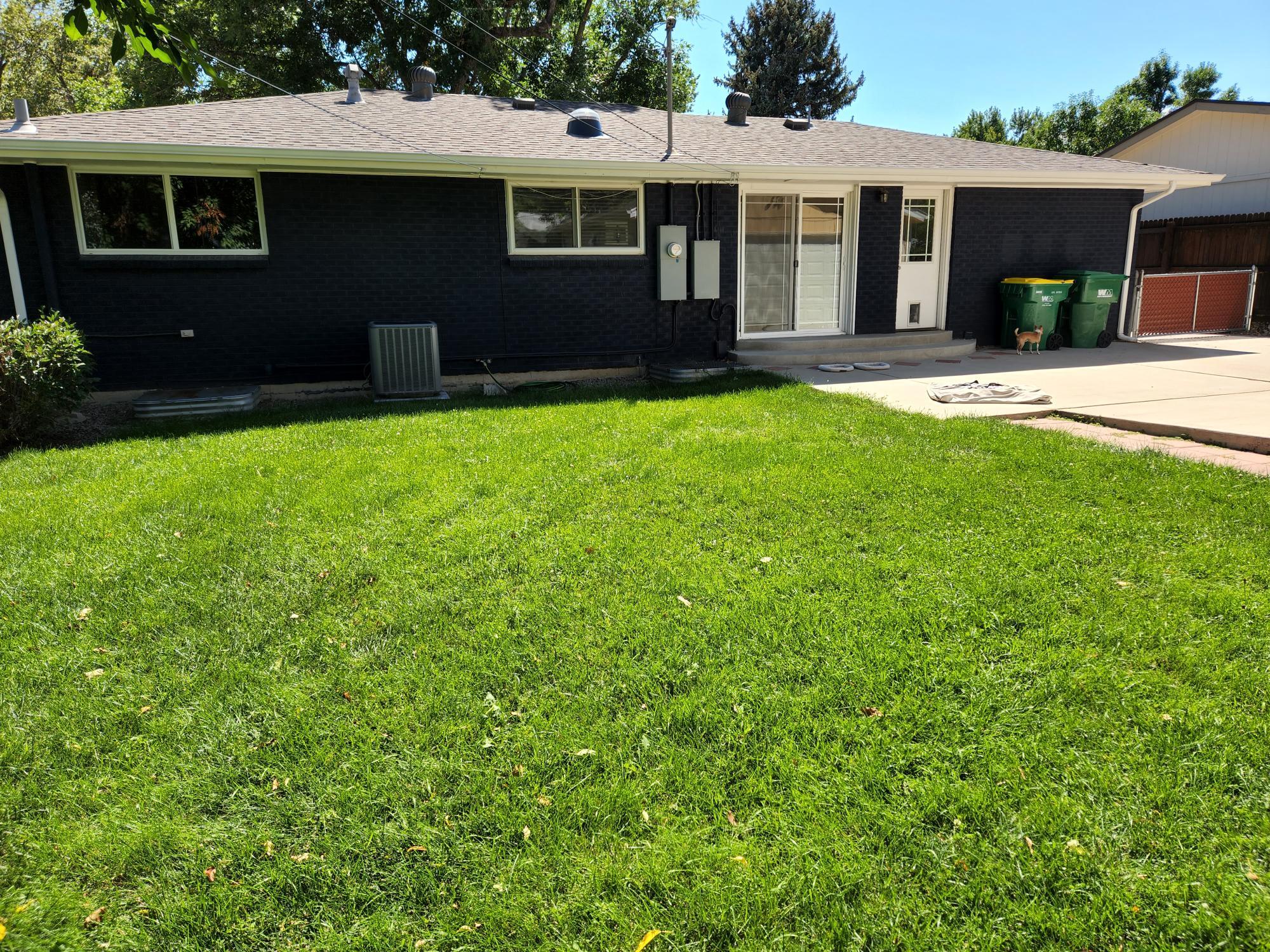 Back of house and fenced yard - 3485 W Powers Pl