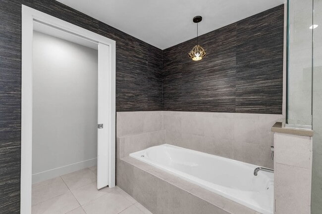 Building Photo - “Sleek Design Meets Walkable Downtown Livi...
