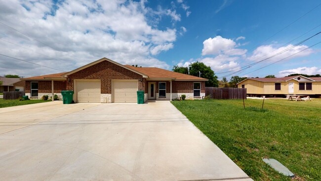 Building Photo - ALL STAINED CONCRETE FLOORING DUPLEX IN HA...
