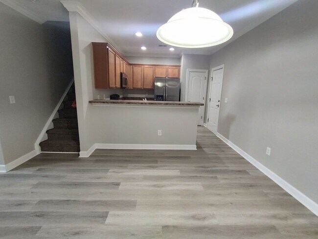 Building Photo - BRAND NEW FLOORING & FRESH PAINT - 3 Bedroom/2.5 Bath Townhome with garage in Wild Wing!