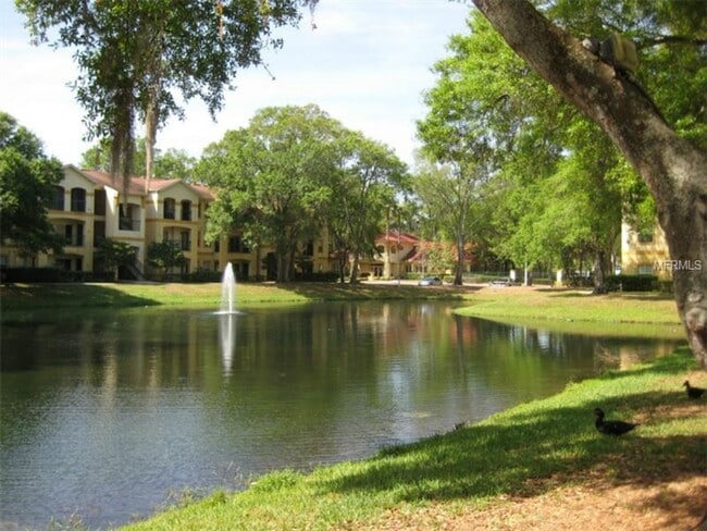Building Photo - Water view! great 2nd floor 1bed/1bath in desirable Pinnacle at Carrollwood condo