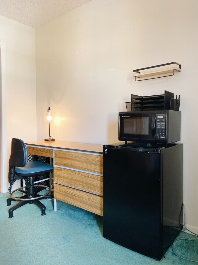 Plenty of light for working. There is no kitchen but there is a refridgerator, microwave and hot pot - 2512 SW 113th Ct