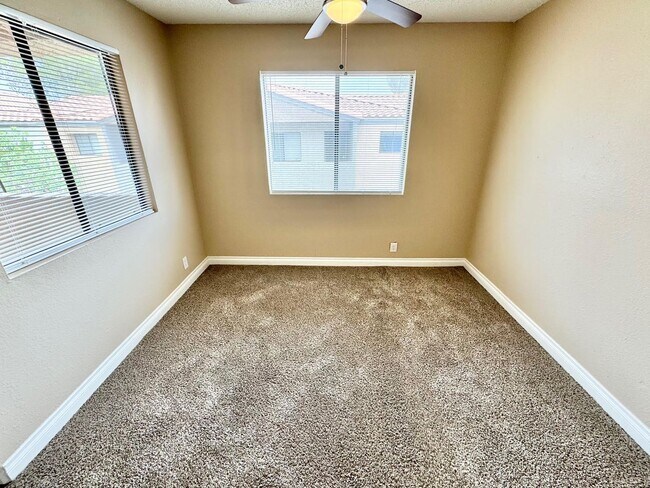 Building Photo - THIS SECOND-FLOOR DESERT SHORES CONDO OFFE...