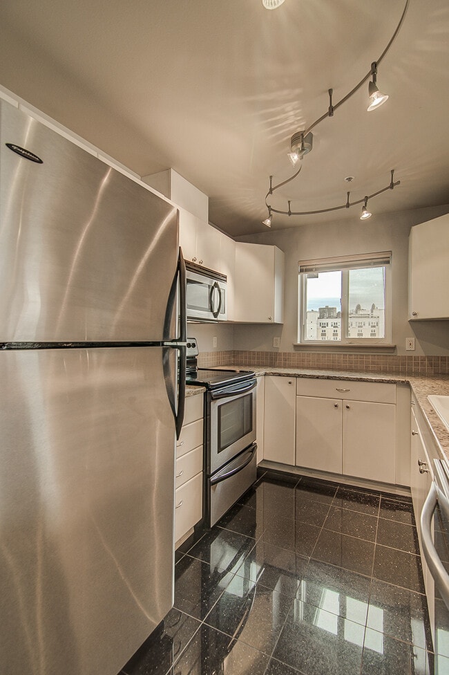 Building Photo - Top floor corner one-bedroom in the heart of it all, don't miss out, tour today!