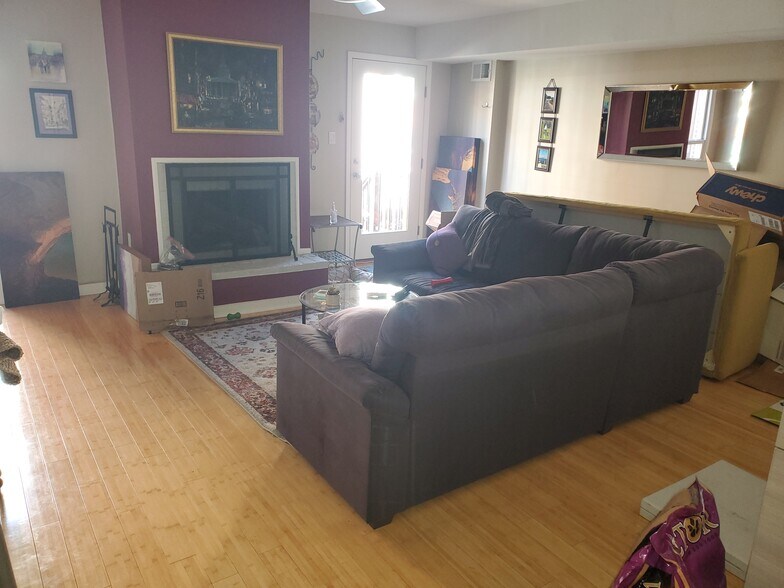 Living room with fireplace (facing back door) - 1429 Corcoran St NW