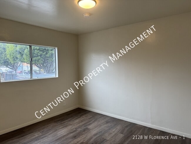 Building Photo - 2128 W Florence Ave