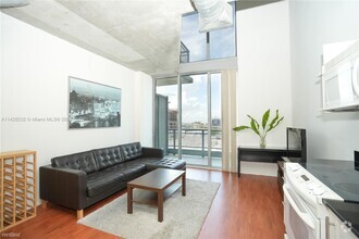 Building Photo - 1 br, 1.5 bath Condo - 690 SW 1st Ct Apt 1209