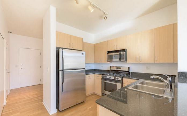 Flooring before it was stained by the owner in 2022 - 1521 N Sedgwick St