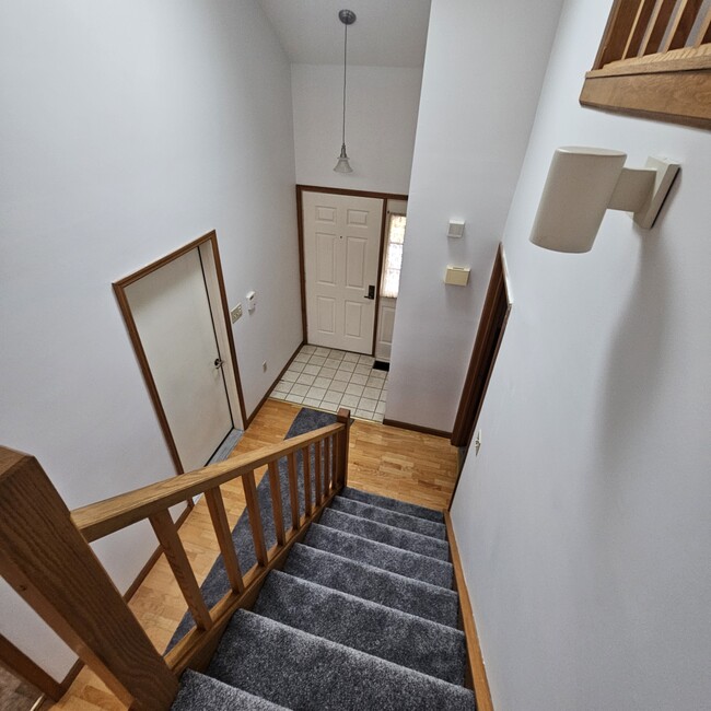 Loft view of front door and garage access on left - 77 Village Dr