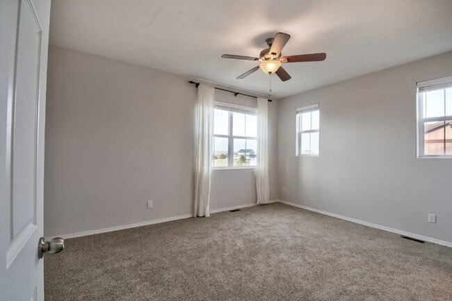 Building Photo - Immaculate 3-Bedroom Townhome with Stainless Steel Appliances and Attached Garage Near Peterson SFB