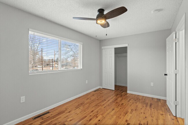 Experience comfort in this sunlit bedroom, complete with modern amenities. - 5580 West 4th Avenue Townhomes
