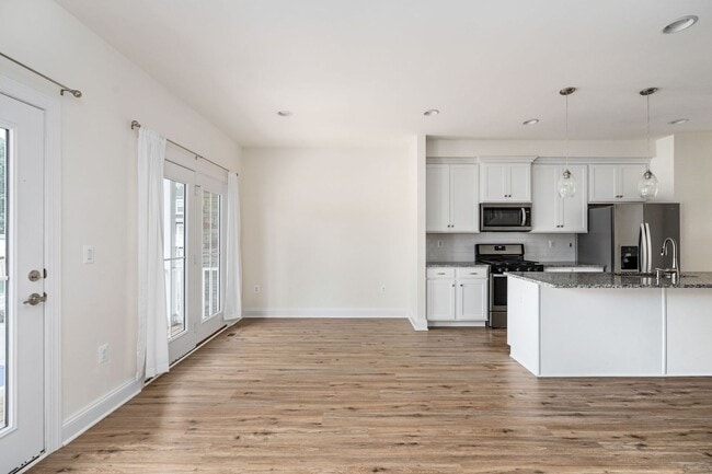 Building Photo - Your Next Home: Modern 3-Level Townhome with Garage, Deck & Huge Flex Space