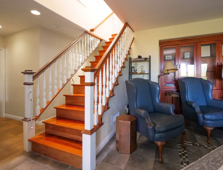 Stairs from living room to family room - 345 Palos Verdes Dr W