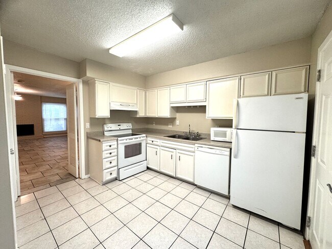 Building Photo - Single-level living on ground floor  |  Fresh paint (July 2026)  |  2 carports  |  Community Pool...