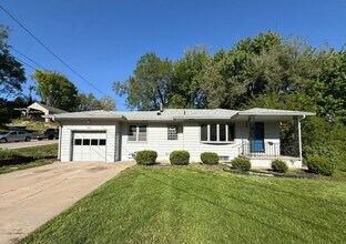 Building Photo - 3 Bed Home with Fireplace Den, Covered Patio & Bonus Living Space