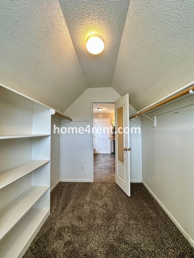 Building Photo - Beautiful Four-Bedroom Home with Three Car Garage, Wood Floors, Finished Basement and a Fenced Ya...