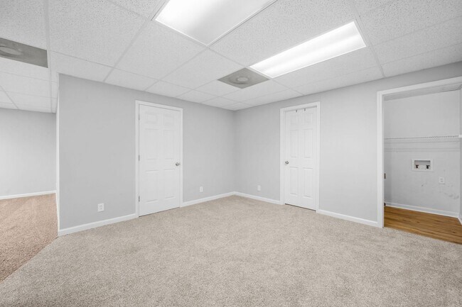 Building Photo - Stunning Stone Fireplace • Finished Basement • Fenced Yard