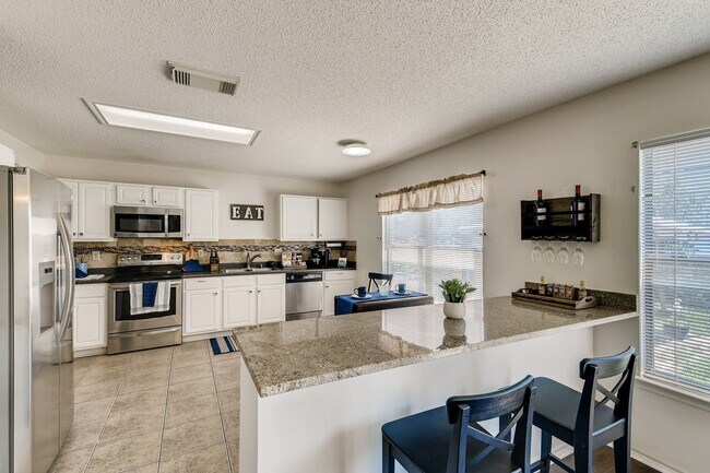 Building Photo - BEAUTIFUL HOME  |  OPEN CONCEPT  |  3 LIVING AREAS  |  FURNISHED OPTION  |  NEAR SCHOOLS & SHOPPING