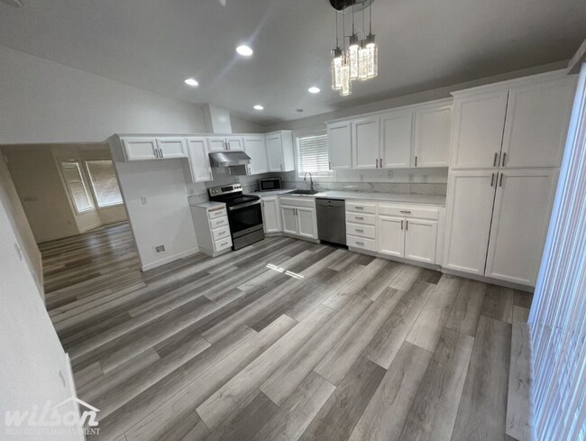 Building Photo - 3 Bed, 2 Bath Home with a Two-Car Garage, Fenced Backyard, and Lawn Care Included