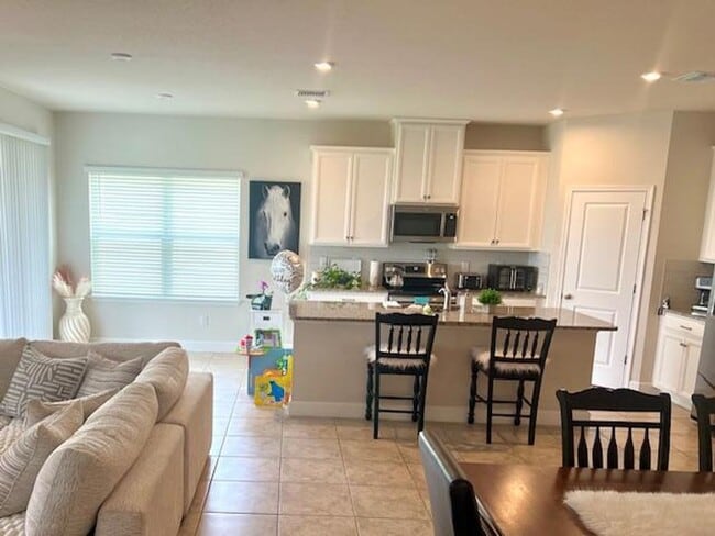Building Photo - Open concept home offering four bedrooms, three baths, a two car garage and open lanai.