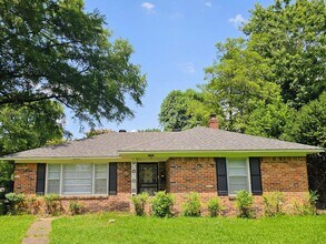 Building Photo - Brick Ranch Charmer with Hardwoods, In-Unit Laundry & Fenced Yard — Available Now!