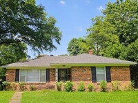 Building Photo - Brick Ranch Charmer with Hardwoods, In-Unit Laundry & Fenced Yard — Available Now!