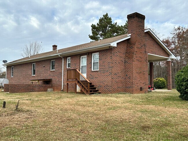 Building Photo - 4-Bedroom Brick Home with Full Unfinished ...