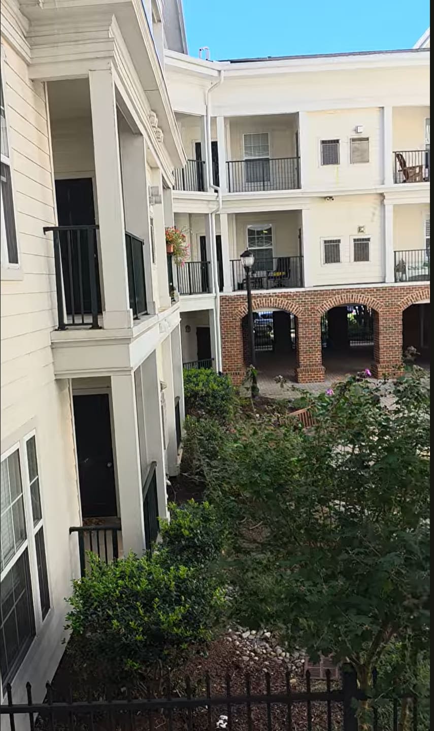 view of balcony and courtyard from garage - 27 Booth St
